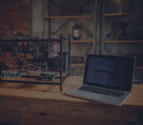 AI mining rig connected to a laptop for AI and machine learning projects.