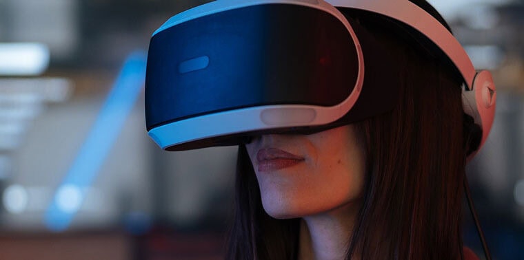 Person using a VR headset demonstrating immersive technology at Softinator TechLabs.