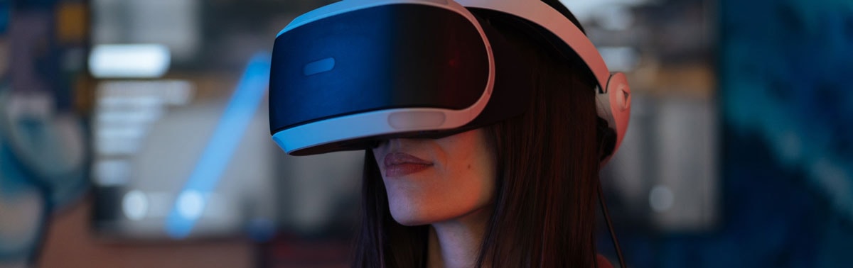 Person using a VR headset demonstrating immersive technology at Softinator TechLabs.