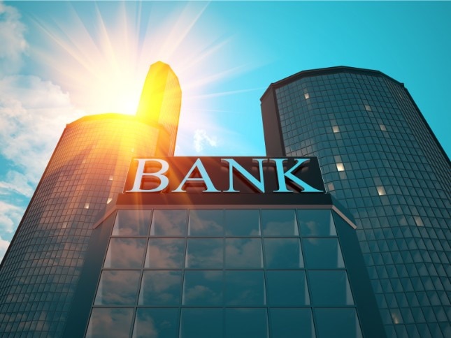 Modern bank building with sunlight, representing financial technology solutions.