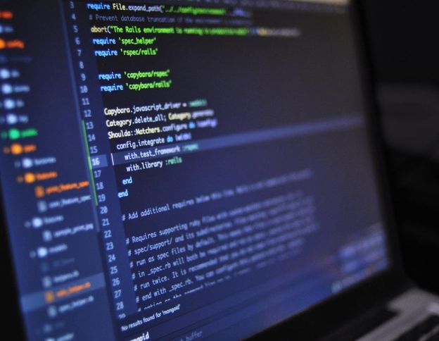 Kotlin programming code on screen for AI and ML development.