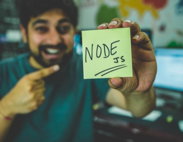 Man holding a note with "Node.js" written on it, promoting Node.js development services.