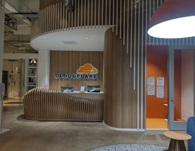 Modern Cloudflare office reception with wooden design elements.