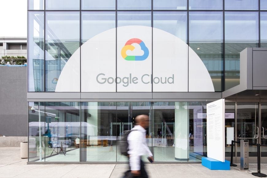 Google Cloud data center with glass facade and logo.