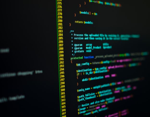 Close-up of PHP code on a computer screen at Softinator TechLabs.