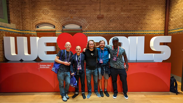 Group of developers at Ruby on Rails event with Softinator TechLabs branding.