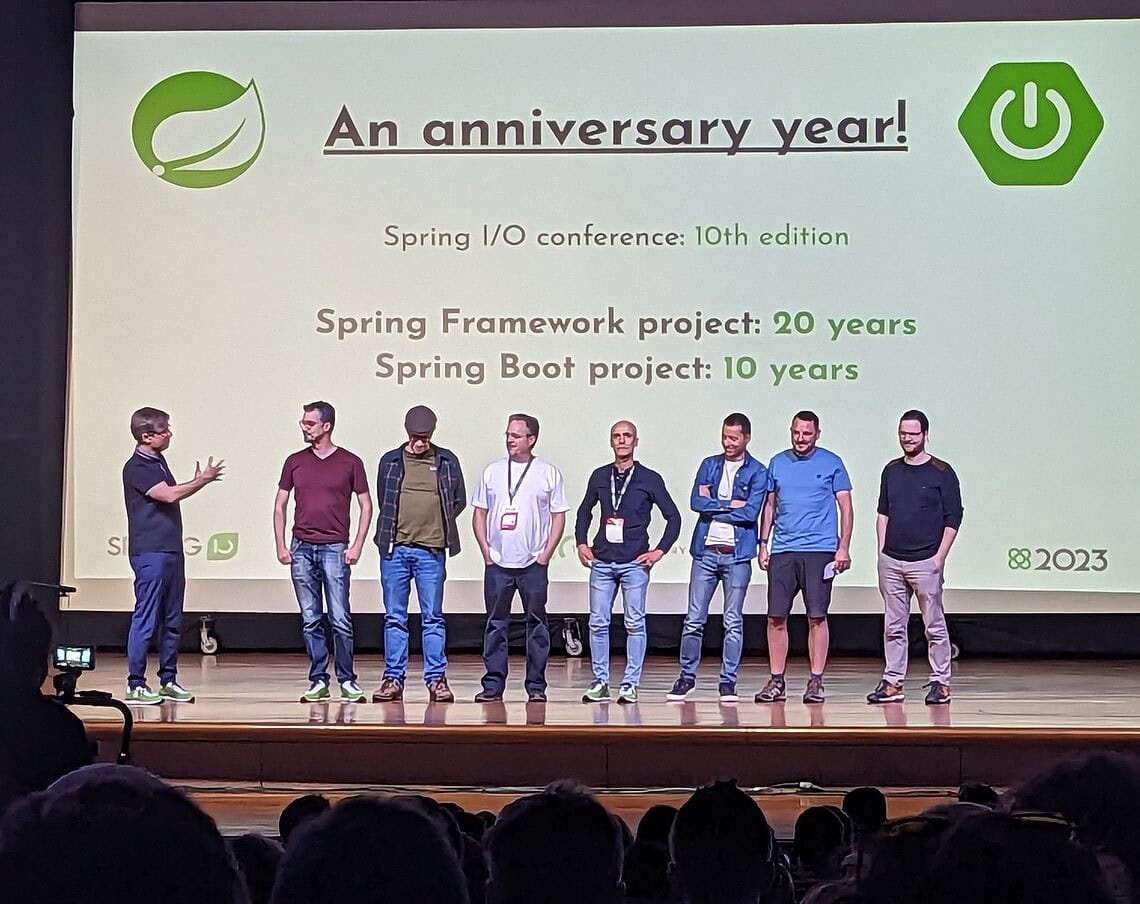 Group of speakers on stage at Spring Boot anniversary event.