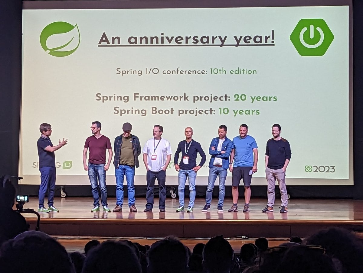 Group of speakers on stage at Spring Boot anniversary event.