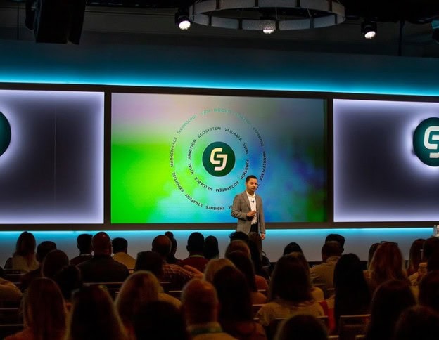 AI and ML developer presenting at a tech conference on stage.