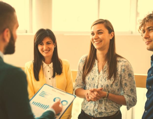 HR consulting team discussing strategies with a client.