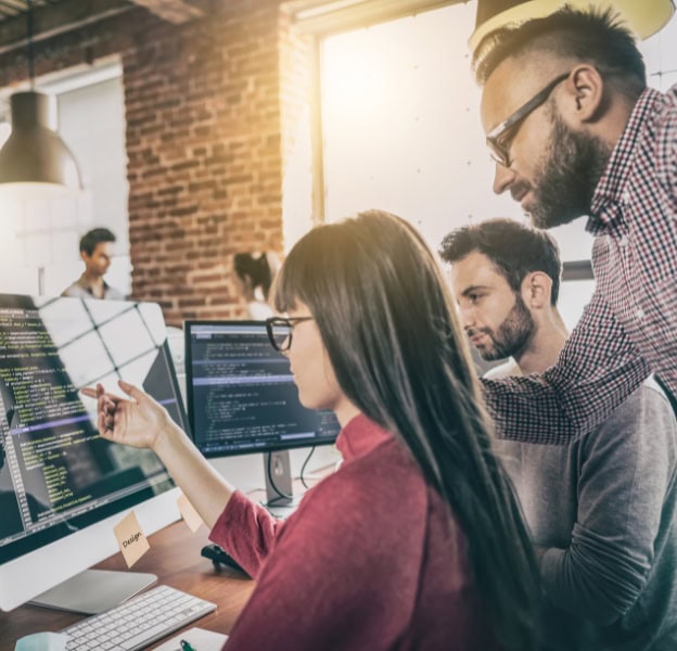 Interns collaborating on coding projects at Softinator TechLabs.