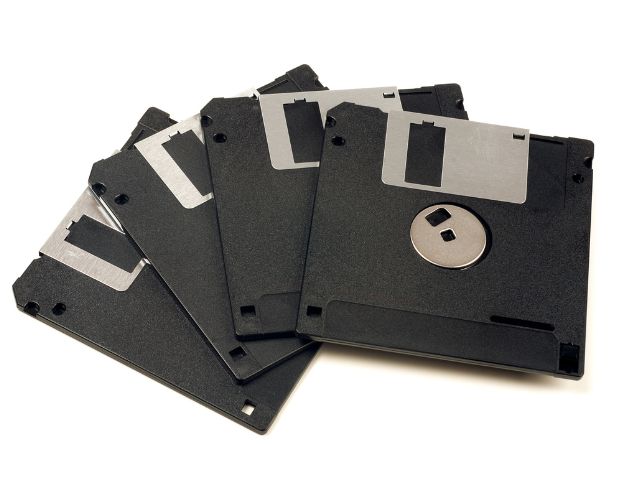 Old floppy disks used for data storage and backup.