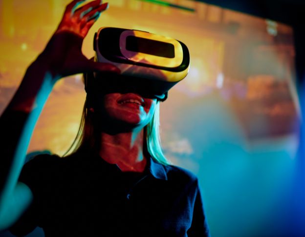 Virtual reality user engaging with VR headset, illustrating virtualization technology.