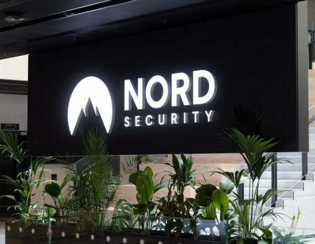 Nord Security logo displayed on a black background with green plants in front.