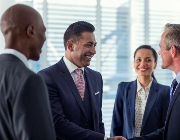 Business team discussing change management strategies in a corporate setting.