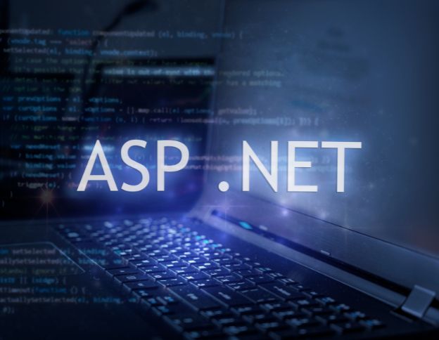 COBOL to .NET migration process with ASP.NET coding on a laptop screen.