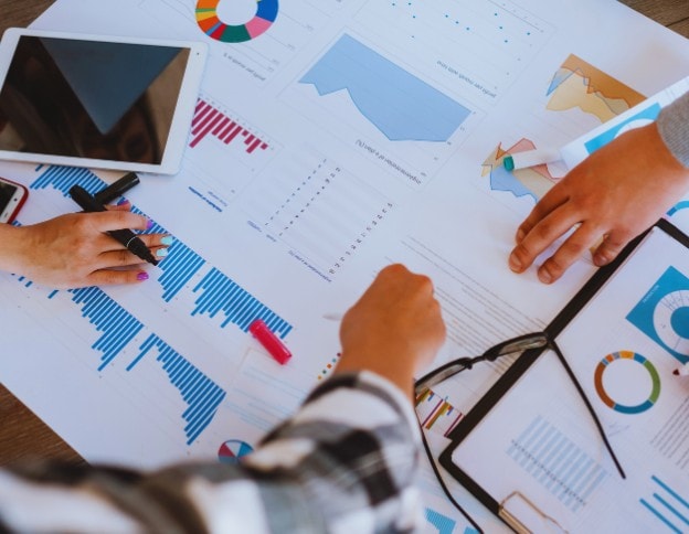 Team analyzing data charts and graphs for configuration management.