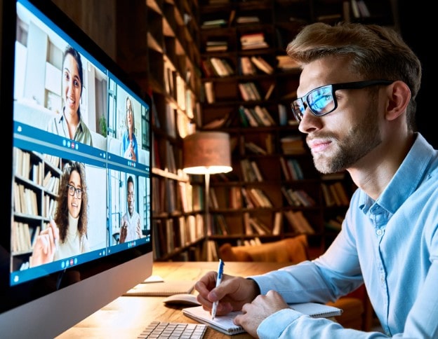 Man participating in online digital literacy training session on computer.