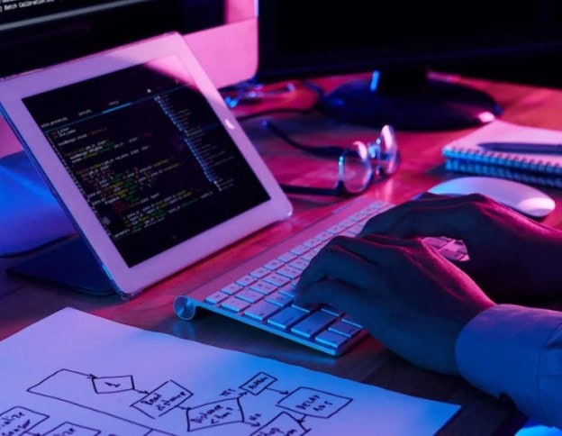 Powered personalization engine coding on tablet screen.