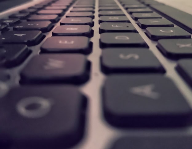 Close-up of a computer keyboard for keyword research analysis.