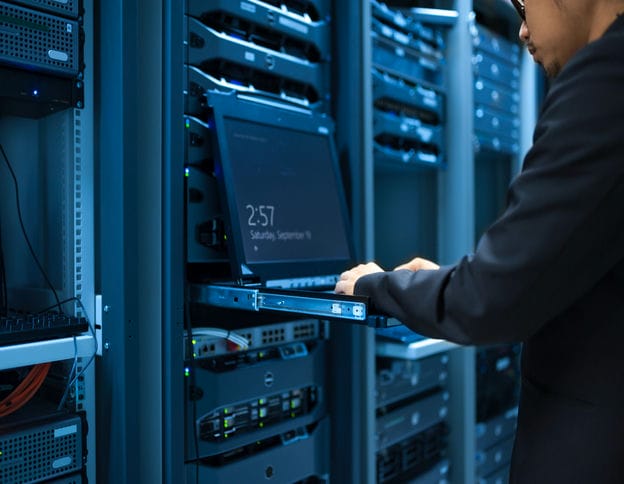 IT professional managing servers in data center for maintenance and support.