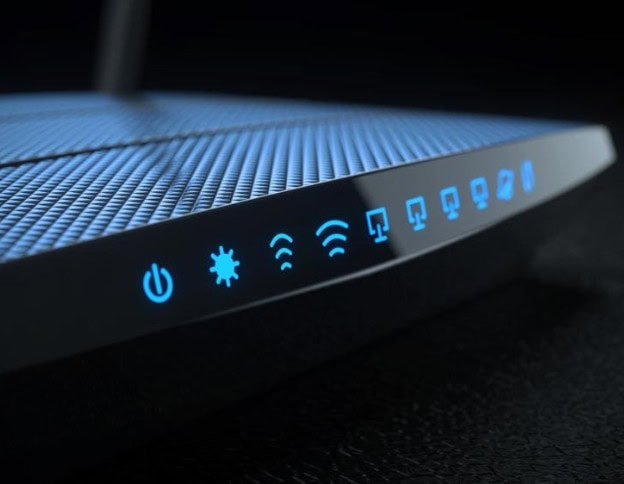 Wireless router with illuminated icons showing network and device connections.