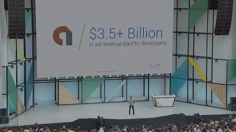 Softinator TechLabs presenting on stage at a conference about mobile app development.