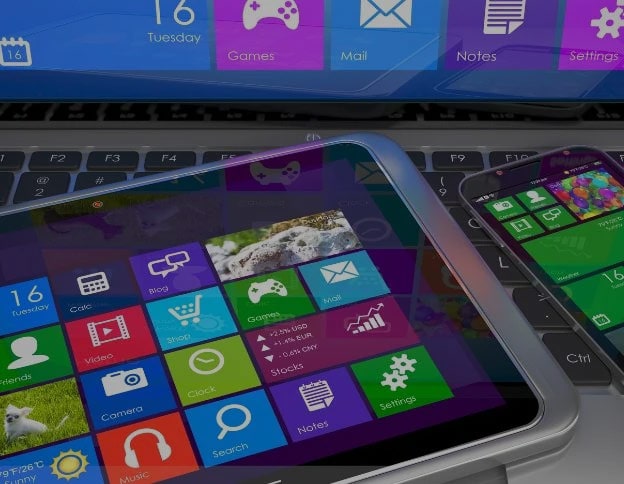 Close-up of smartphones displaying colorful mobile app icons for various functions.