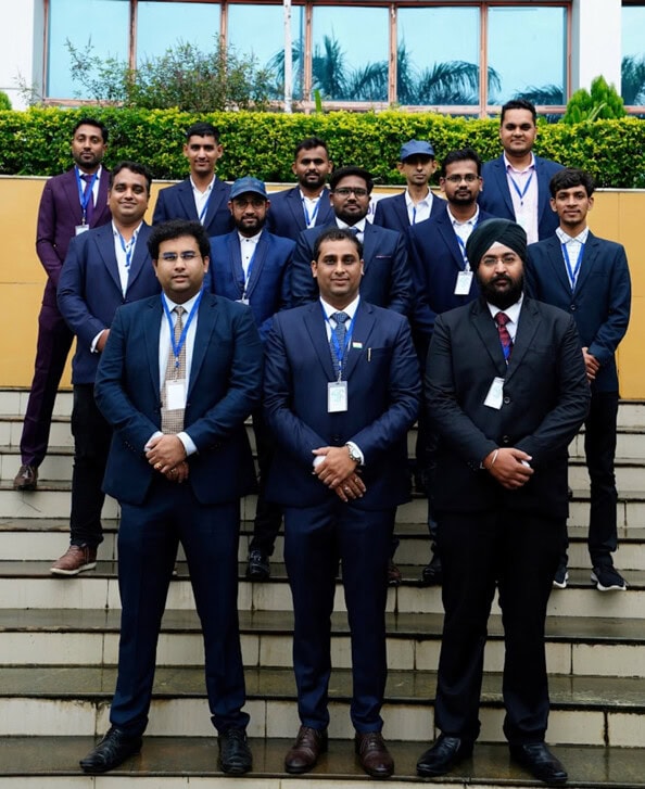 Group photo of Softinator TechLabs AI and ML developers outside office.