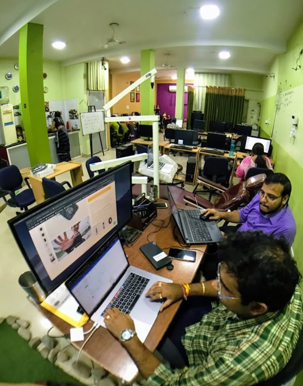 AI and ML Developers in a Modern Office Environment.