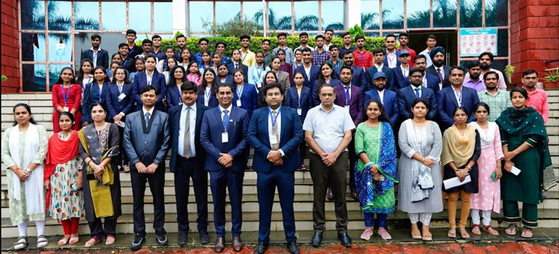 Group photo of Softinator TechLabs AI and ML developers outside the office.