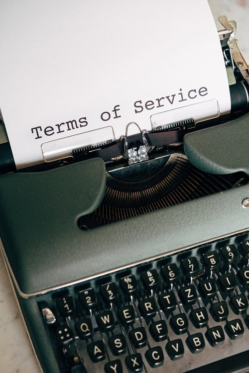 Close-up of a typewriter with "Terms of Service" document.