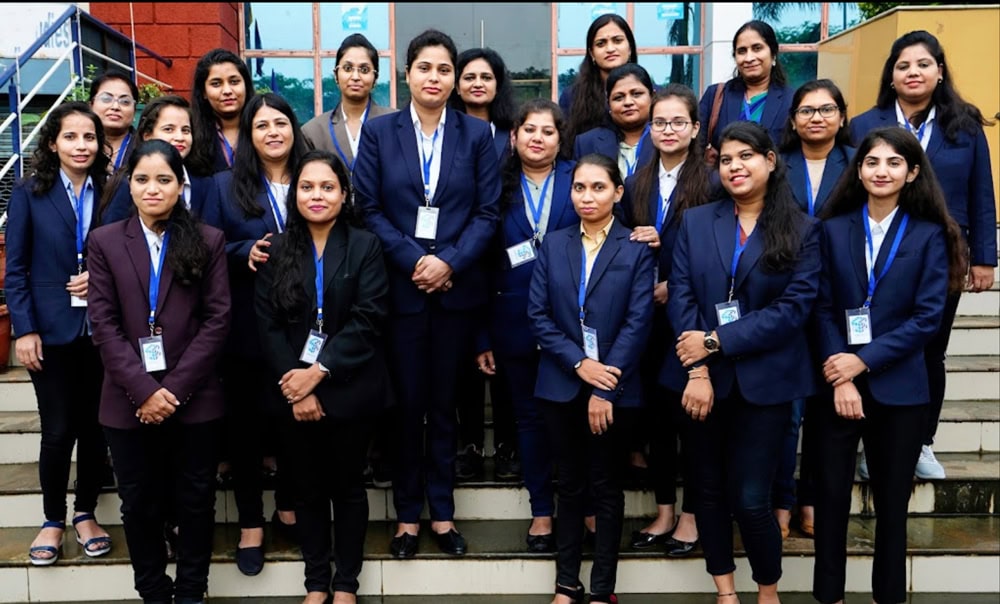 Group of professional women in business suits outside office building.