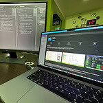 Developer working on Android app code on dual screens at Softinator TechLabs.