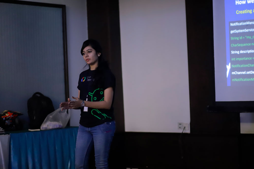 Softinator TechLabs Team Presentation Female presenter explaining AI and ML concepts during a company event.