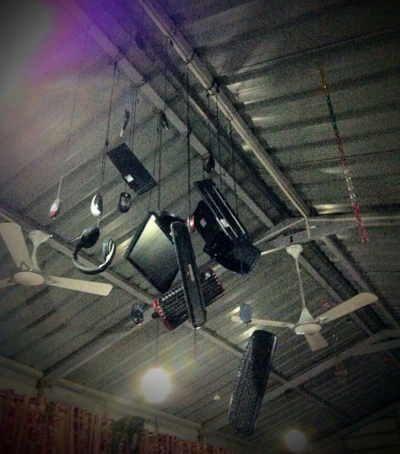 Modern tech workspace with hanging monitors and audio equipment at Softinator TechLabs.